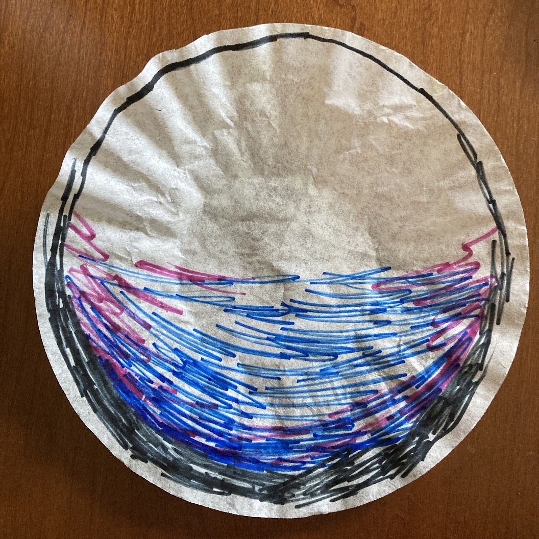 A coffee filter with a sketchy black circle drawn around the outside that is thicker on the bottom than the top and a blue and purple ombre pattern on the bottom half.